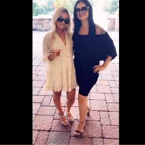 Beige long sleeve open back ruffled summer dress.